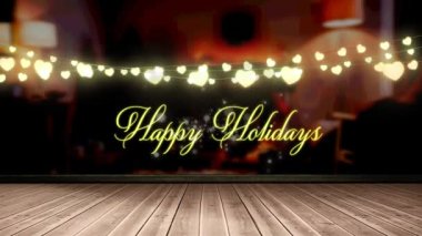 Peri ışıklarının animasyonu ve ahşap tahtaların üzerinden mutlu bayramlar metni. Noel, kış, gelenek ve kutlama konsepti dijital olarak oluşturulmuş video.