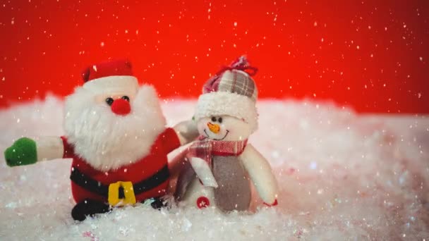 Snow Falling Santa Claus Snowman Toy Red Background Christmas Festivity — Stock Video