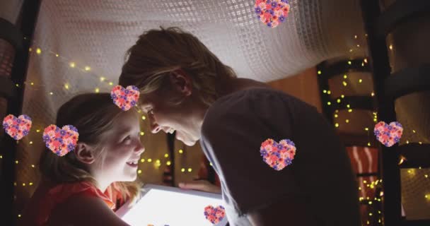 Animation Flower Hearts Happy Caucasian Mother Daughter Using Tablet Makeshift — Stock Video