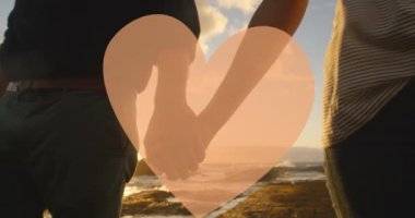 Kırmızı kalbin, el ele tutuşan insanlar üzerindeki animasyonu. kadın gücü, feminizm ve cinsiyet eşitliği konsepti dijital olarak oluşturulmuş video.