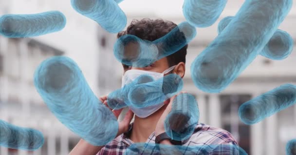 Yüz Maskesi Takan Latin Adamın Üzerindeki Virüs Hücrelerinin Animasyonu Küresel — Stok video