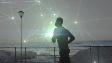 Sahilde koşan Afro-Amerikan bir adam için bağlantı ağının animasyonu. sağlıklı aktif yaşam tarzı ve küresel ağ konsepti dijital olarak oluşturulmuş video.