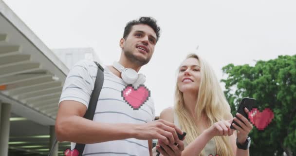 Animation Heart Icons Floating Happy Caucasian Couple Talking Using Smartphone — Stock Video