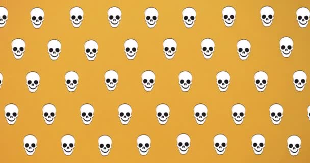 Turuncu Arka Planda Düşen Kafataslarının Animasyonu Cadılar Bayramı Geleneği Dijital — Stok video