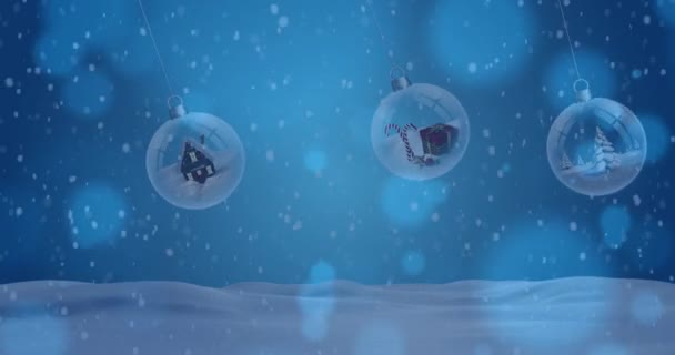 冬の風景の中でクリスマスの泡の上に落ちる雪のアニメーション クリスマス お祝いのコンセプトをデジタルで — ストック動画