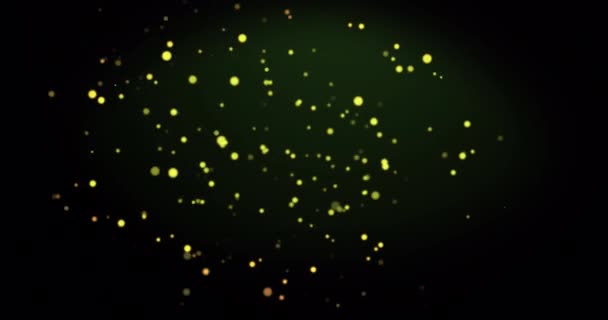 緑の背景に暖かい輝く黄色の斑点のアニメーション 光や色や動きの概念をデジタルで生成し — ストック動画