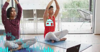 Yoga partnerleri dizüstü bilgisayara başlayıp meditasyon yaparken sağlık simgeleri ve çubukları takip ediyorlar. Farkındalık, işbirliği, sükunet, dijital sağlık, uyum, denge, refah