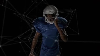 Erkek sporcu kask takarken aynı zamanda futbol şovu ağı teknolojisini geliştiriyor. Dinamik, atletik, fütüristik, hareket, güç, kararlılık, yenilik