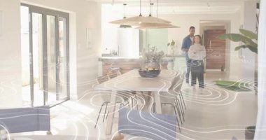 Çift mutfaktan çıkıyor. Erkek telefonlarını dinliyor. Kaplamayı başlatıyor, kahvaltı için sofra takımı hazırlıyor. İç mekan, yaşam tarzı, minimalist, çağdaş, konukseverlik, uyum, sıcaklık