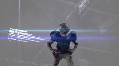 Oyun kurucu mavi ışık süpürgesine tepki veren futbolu kavrıyor, spor teknolojisinde ikili kodlar atıyor. Dijital, gelecekçilik, teknoloji, hareket, atletik, yenilik, zarafet