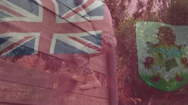 Engelli duvara ayak basan adam, canlandırmalı İngiltere ya da Bermuda kaplamalarıyla fitness için tırmanmaya başlıyor. Açık hava, spor, güç, engel, eğitim, macera, dayanıklılık