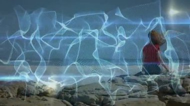 Woman brushing hair back for clear ocean view on outcrop as technology overlay pulsing with breeze. Nature, serenity, digital art, tranquility, adventure, mindfulness, aesthetic