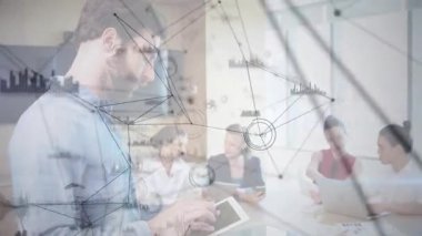 Bearded man tapping tablet visualizing network data overlay around colleagues at business meeting. Technology, teamwork, collaboration, digital, innovation, corporate, modern