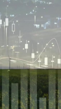 Rüzgâr türbinleri şehrin ışıklarının yanında finans animasyonlarıyla enerji üretiyor. Sürdürülebilirlik, yenilenebilirlik, güç, elektrik, yatırım, kentsel