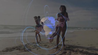 Ebeveynler sahilde koşuyor, çocukları taşıyor, taşıyıcıları değiştiriyor, dünyayı aydınlatıyor. Aile, macera, birlik, doğa, açık hava, bağ, sağlık