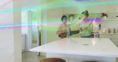 Eğitmen, mutfakta yoga minderini müşteriye veriyor. Refah ve nefes alma konusunda rehberlik ediyor. Sağlık, egzersiz, farkındalık, yaşam tarzı, evcil, çağdaş, fitness