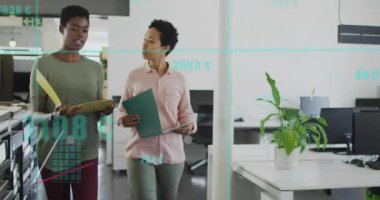 Two female colleagues flipping files and analyzing overlaid charts showing rising business metrics. Collaboration, teamwork, data, analytics, professional, office, growth