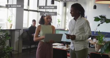 Two coworkers tapping phones, causing social notifs to pop, stack then fade while reviewing ads. Collaboration, coworking, daylight, openplan, modern, devices, notifications