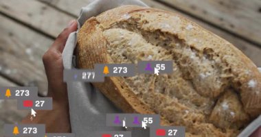 Baker 'ın elleri ahşap masanın üzerine somun kaldırarak pazarlama ikonlarının dalgalanıp çatışmayı göstermesine neden oluyor. Zanaatkar, köylü, fırın, aşçı, el yapımı, yiyecek, zanaat