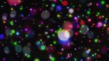 Siyah tuval boş başlıyor, parlayan küreler sürüklenerek kayboluyor, titreşiyor, ışıl ışıl duvar halısı oluşturuyor. Soyut, dijital sanat, ışıltı, hareket, canlı, kozmik, ortam