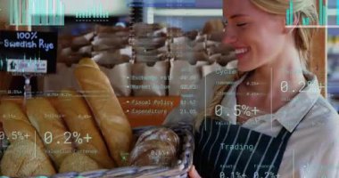 Sepete odaklanan çerçeve, fırın işçisinin ekmeği yerleştirmesi, finans onun etrafında güncelleme yaparken. Fırın, somun, baget, hasır, çavdar, ekran, perakende