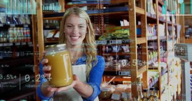 Tezgahtar gülümseyen kavanozu perakende satışları göstermek için kavanozun üzerinde çizelgeler beliriyor. Market, zanaat, tezgah, şişeler, ölçek, ekran, sıcak