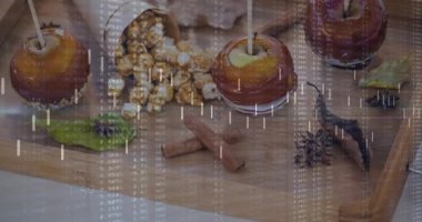 Dijital kaplama görünen ve düşen çubuklar statik karamelli elmaların üzerinde kayarak sayıları ortaya çıkarıyor. Düz döşeme, yemek, tatlı, garnitür, köy, ahşap, ekran