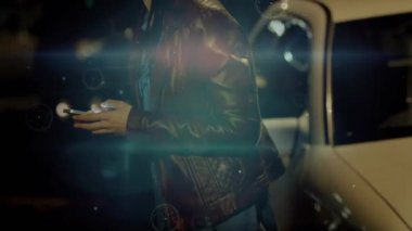 Woman tapping phone beside car, checking street for oncoming traffic while tech overlays animating. Night, urban, smartphone, bokeh, streetlights, headlights, sidewalk