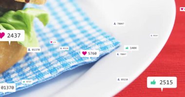 Uyarı baloncukları yüzüyor, çoğalıyor ve birikiyor. Kamera içeri giriyor, hamburger vızıldıyor. Sandviç, istif, düz yatak, yakın çekim, tepkiler, masa üstü, canlı