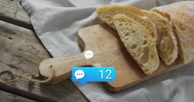 Mavi baloncuk sapın yanında beliriyor, rakamları güncelliyor, beyaz baloncuklar çıkıyor, büyümeyi canlandırıyor. Ekmek, kesme tahtası, somun, dilimler, kırsal, masa üstü, keten