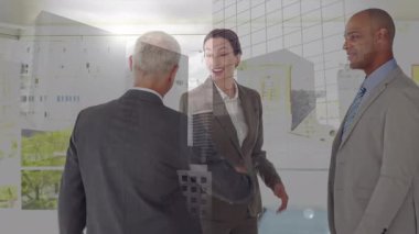 Animation of cityscape over diverse business people working at office. Global business, finances and digital interface concept digitally generated video.