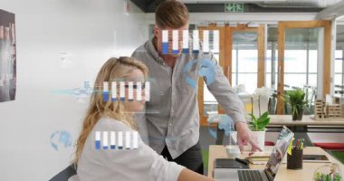 Animation of financial data processing over diverse business people in office. Global business, finances, computing and data processing concept digitally generated video.