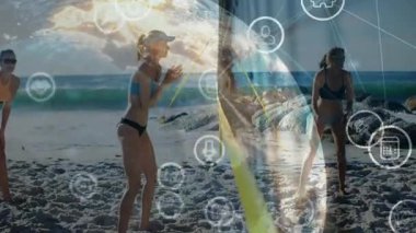 Kadınlar plajda ağ üzerinden el çırpıyor ve ağ için ikonlar oluşturarak dijital küreyi şekillendiriyor. Spor, fitness, takım çalışması, dijital, teknoloji, bağlantı, eğlence