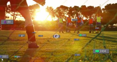 Spor kalecisi atıcı dönüşünü gösteriyor, duvardan serbest atış yapıyor yükselen seyirci sayacı gün batımını seyrediyor. Atletik, takım çalışması, motivasyon, rekabetçi, açık hava, dinamik, eğitim