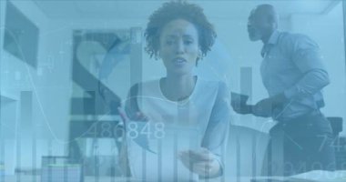 Animation of financial data processing over businesswoman in office. Global business, finance, computing and data processing concept digitally generated video.