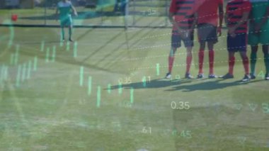 Animation of financial data processing over football players. Global sports, finance, computing, connections and data processing concept digitally generated video.