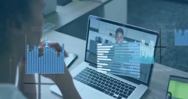 Animation of financial data and graphs over african american woman having video call on laptop. Business, finance, economy and technology concept digitally generated video.