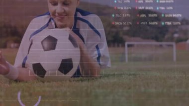 female player rolling ball activating sports analytics overlaying charts sitting analyzing metrics. Athlete, sports, collaboration, technology, outdoor, fitness, innovation