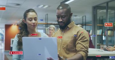 Woman pointing while man tapping laptop touchpad animated icons growing around pair for marketing. Collaboration, coworking, workspace, modern, teamwork, digital, ui