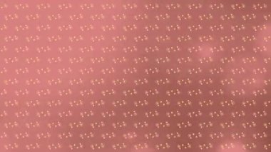 This animation showcases multiple pink spots of light moving in a hypnotic motion against a pink background. The colour and movement of the spots create a digital image that is both calming and visually appealing.