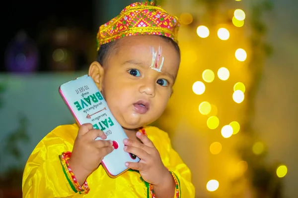 Cute Baby Boy on load krishna getup for krishna festival. Baby Boy Dressed Up As Little Krishna.