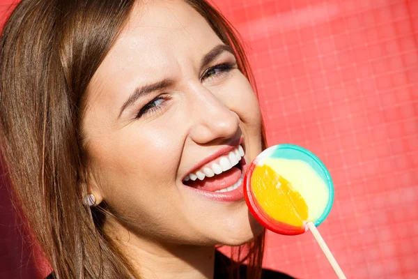 Beautiful woman having fun with lollipop — Stock Photo, Image