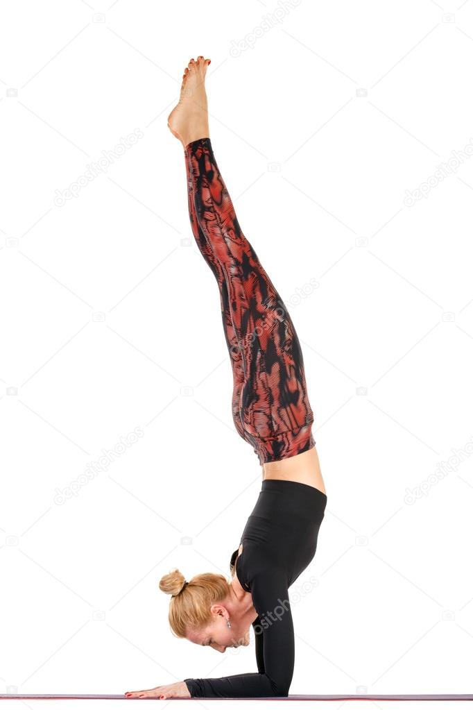 Sport fitness woman doing yoga exercises, shoulder stand, full length portrait isolated over white background