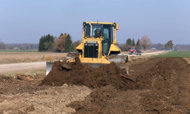 Buldozer çekilen alanları, Kedainiai ve Litvanya 'yı karşılaştırıyor.