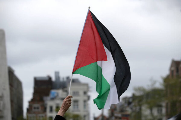 Palestinian waving flags in Amsterdam