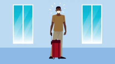 Genç gezgin Afro adam bavullu tıbbi maske takıyor.