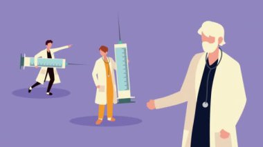 Aşı şırıngalarıyla çalışan doktorlar.