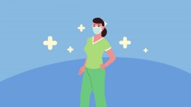 Hemşire yeşil üniformalı tıbbi maske takıyor.