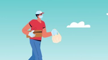 Teslimat elemanı kutu ve çantayla yürüyor.