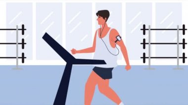 Genç adam yürüyüş makinesinde egzersiz yapıyor.